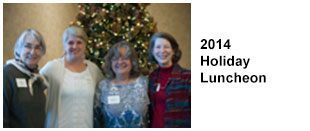 2014 Holiday Luncheon. Four smiling volunteers.