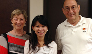 English instruction volunteer couple with female English student.